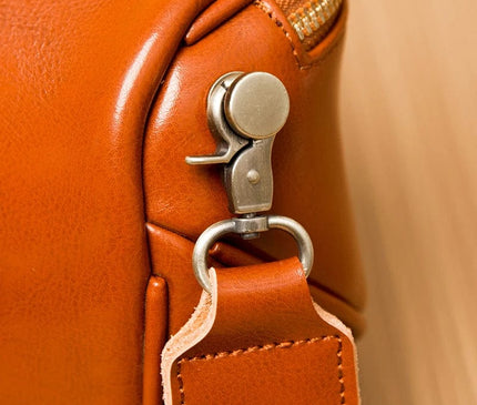sac-bandouliere-arrondi-marron-motifs