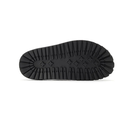 mule-noire-minimaliste-boucle-ajustable-semelle-rainuree