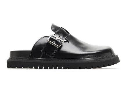 mule-noire-minimaliste-boucle-ajustable-semelle-rainuree