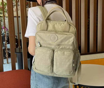sac-a-dos-noir-compact-multi-poches-zippes-36l-55l