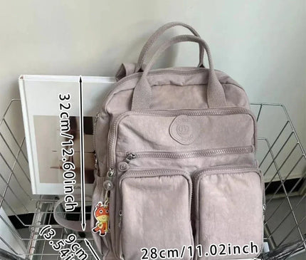 sac-a-dos-noir-compact-multi-poches-zippes-36l-55l