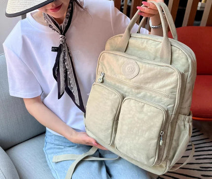 sac-a-dos-noir-compact-multi-poches-zippes-36l-55l