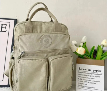 sac-a-dos-noir-compact-multi-poches-zippes-36l-55l