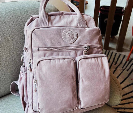 sac-a-dos-noir-compact-multi-poches-zippes-36l-55l