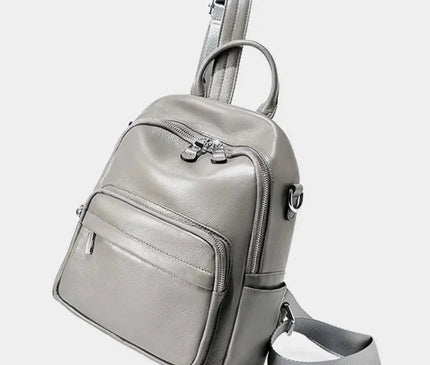 sac-compact-cuir-noir-arrondi-details-zippes