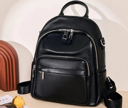 sac-compact-cuir-noir-arrondi-details-zippes
