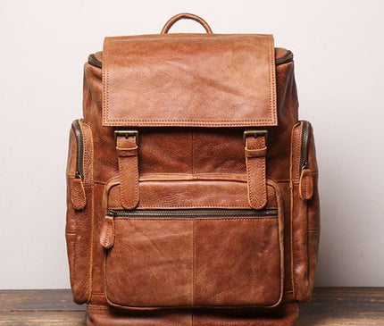 sac-baroudeur-cuir-brun-poches-multiples-design-retro-robuste