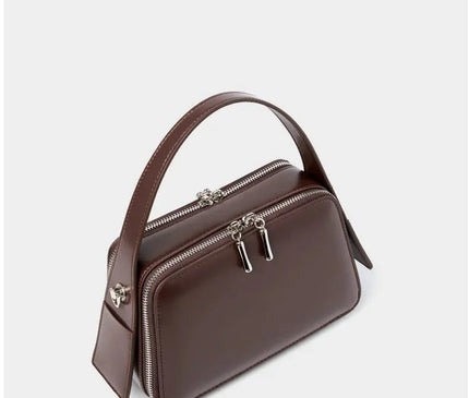 sac-bordeaux-rigide-bandouliere-poignees-argentees
