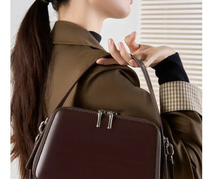 sac-bordeaux-rigide-bandouliere-poignees-argentees