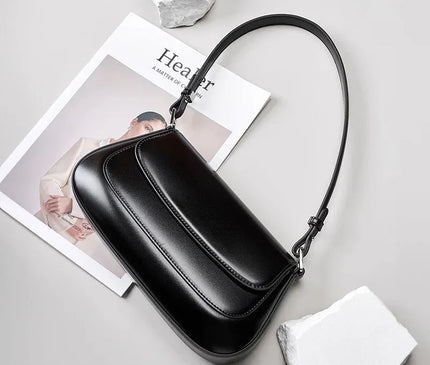 sac-noir-minimaliste-rabat-arrondi