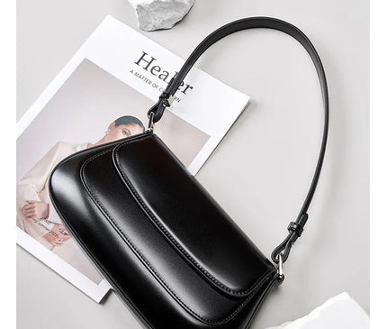 sac-noir-minimaliste-rabat-arrondi