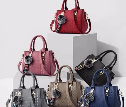 sac-a-main-compact-avec-sangle-ajustable-et-pompon
