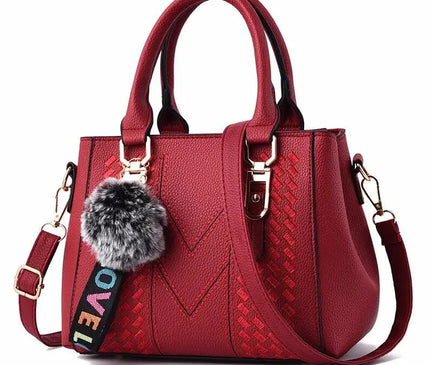 sac-a-main-compact-avec-sangle-ajustable-et-pompon