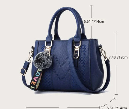 sac-a-main-compact-avec-sangle-ajustable-et-pompon
