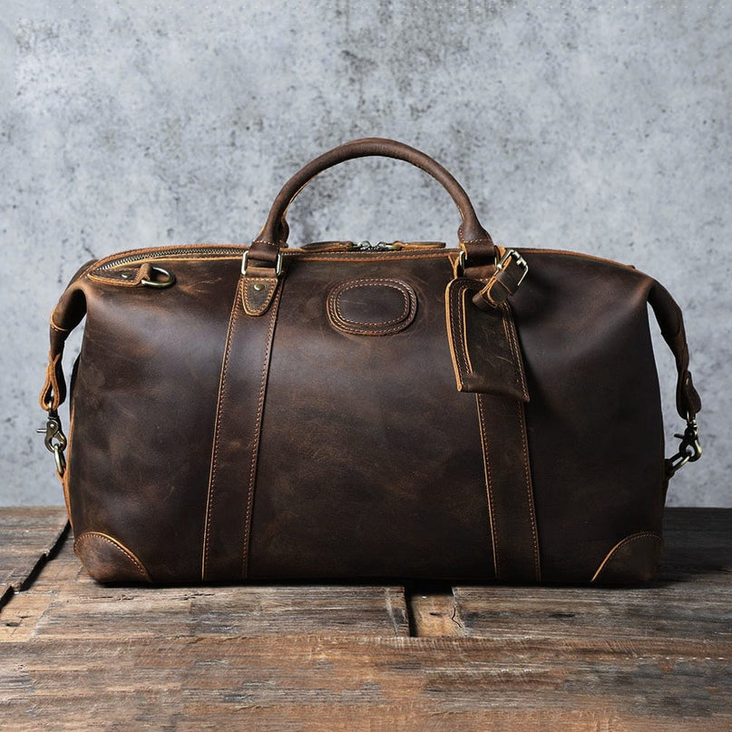 sac-de-voyage-patine-bandouliere-poignee